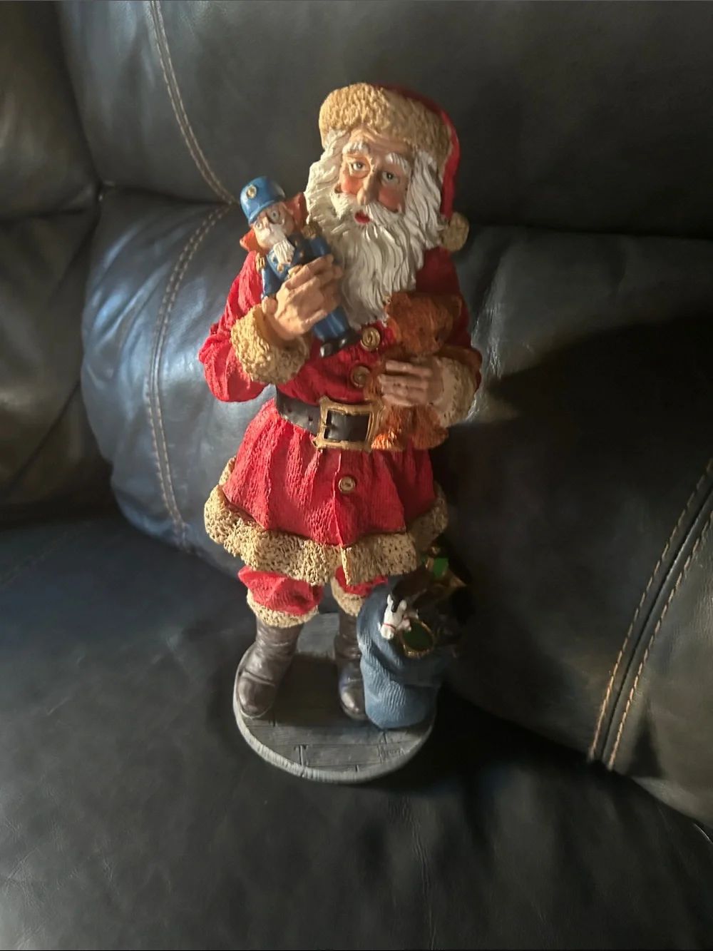 Vintage old, looking Red and Cream Santa Figurine Holding Nutcracker